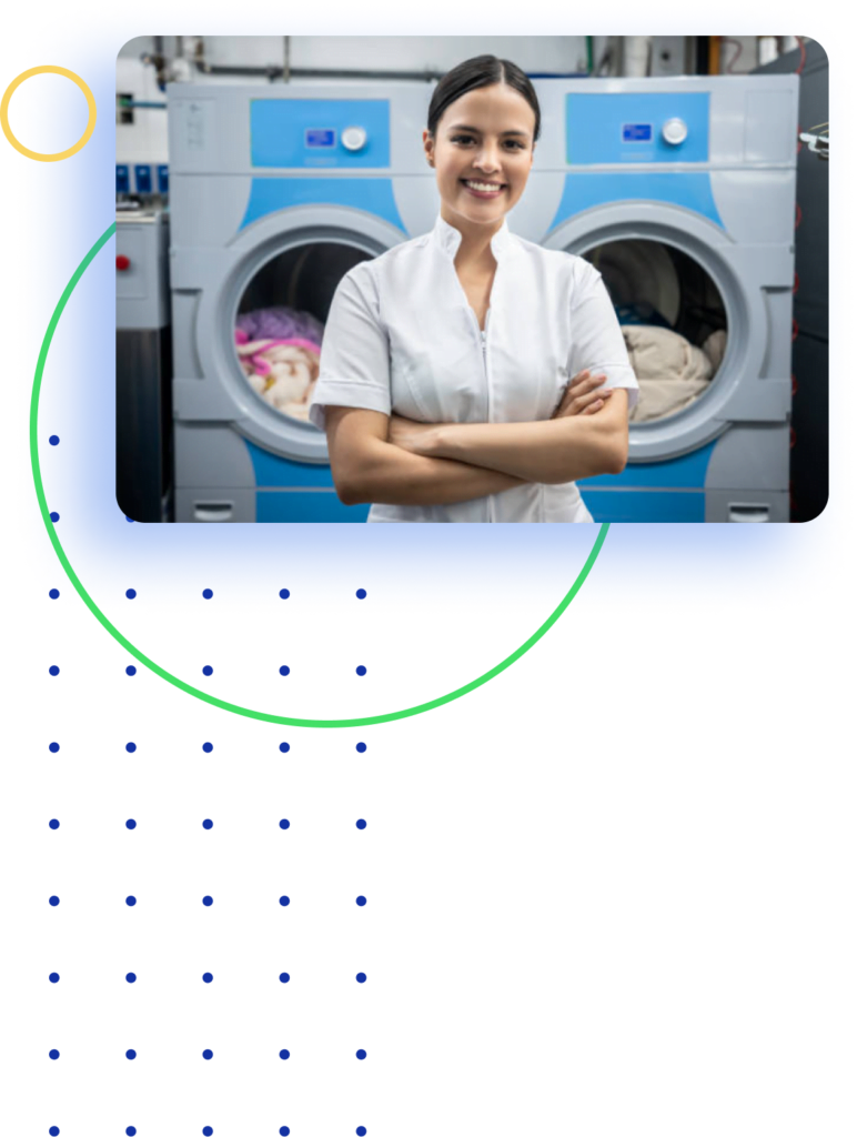 Laundry Genie Wash and fold employee standing in front of commercial laundry machines your wash and fold professionals in Pearland TX